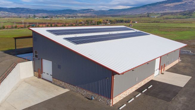 Metal building with solar panels - JAG Metals